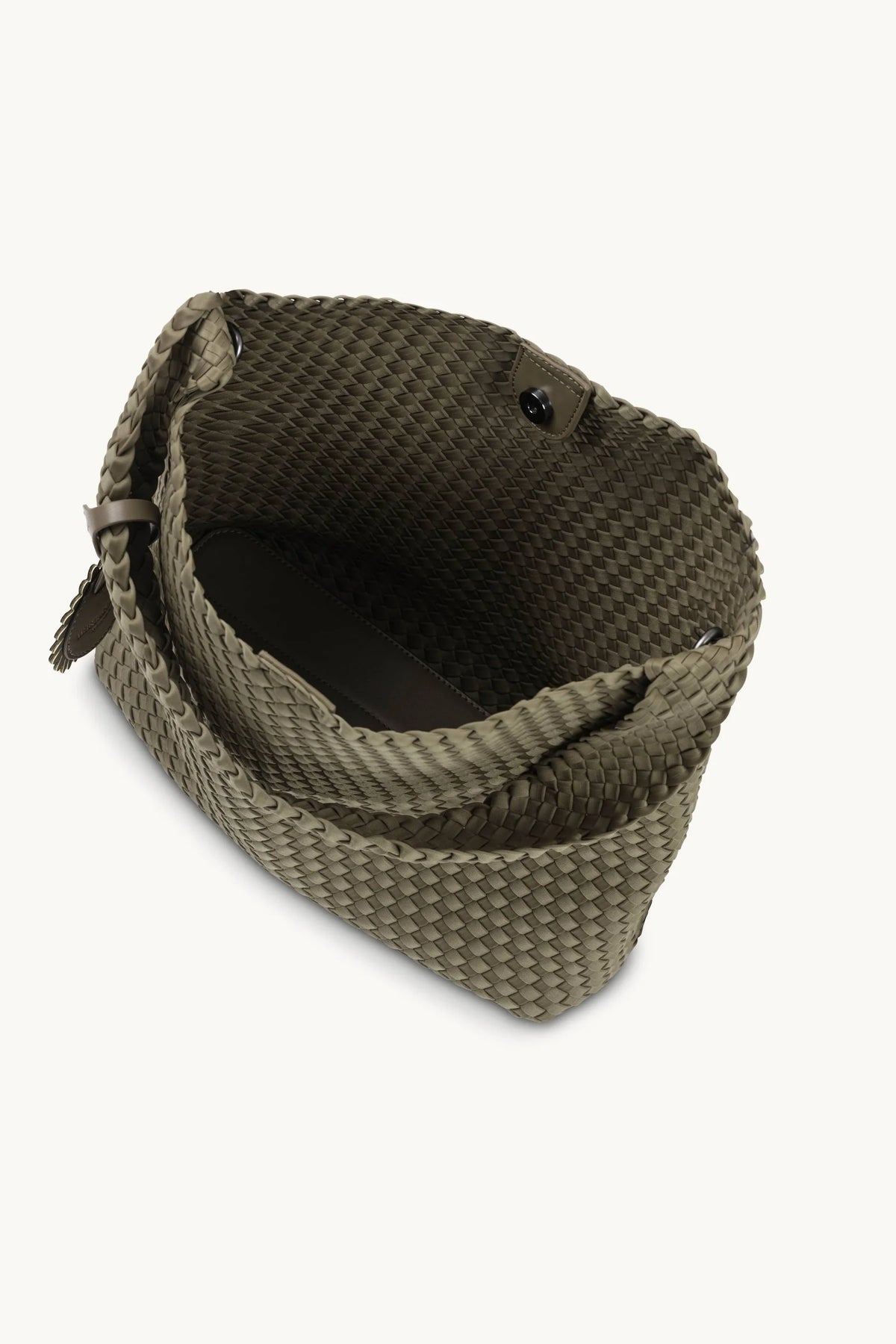 An olive green woven leather shoulder bag with a slouchy, open-top silhouette, shown from a high-angle perspective against a light off-white background.