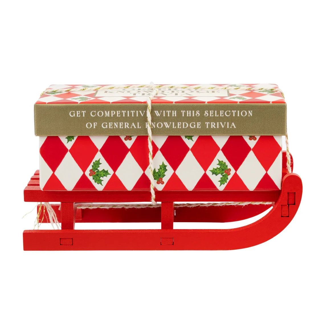Red sleigh with a wrapped gift on top against a white background