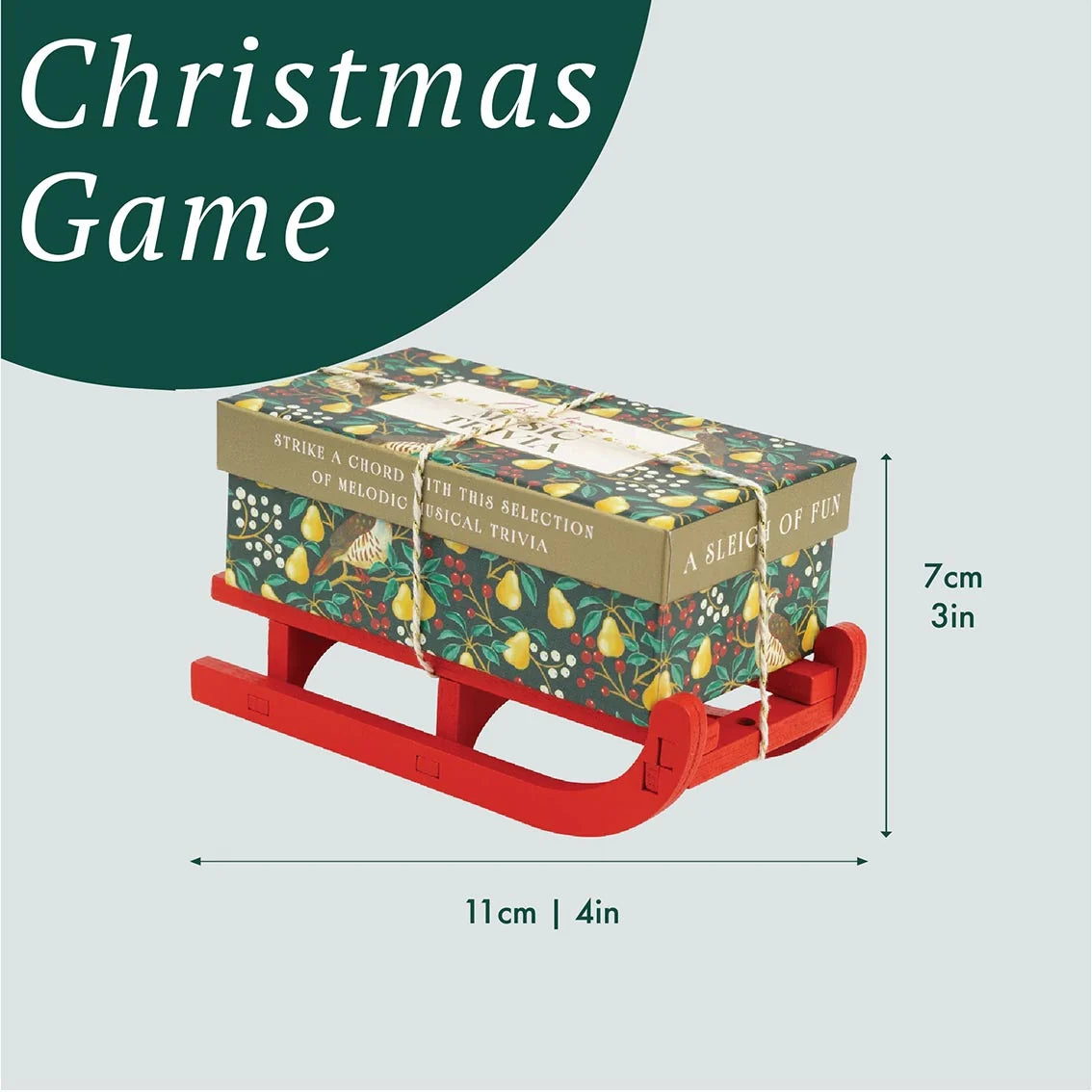 Small box with decorative design on a red sled, labeled 'Christmas Game', with dimensions indicated.
