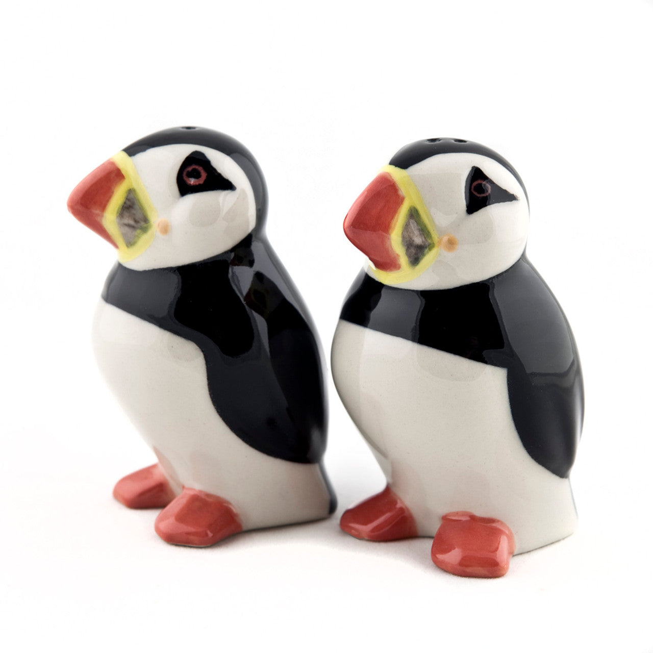 Pair of ceramic puffin salt and pepper shakers.  Black, white, and red detailing.