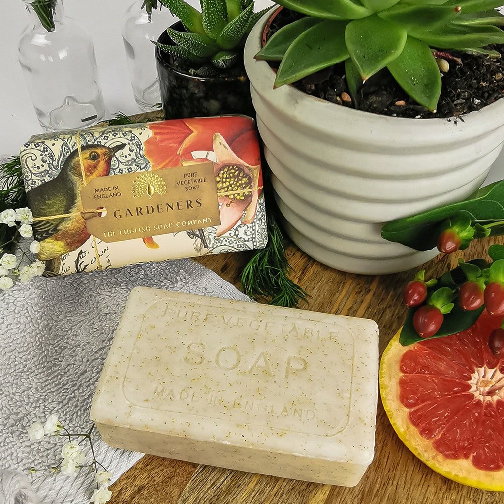 Rectangular bar of pure vegetable soap, off-white with embossed text, "Pure Vegetable Soap" and "Made in England".