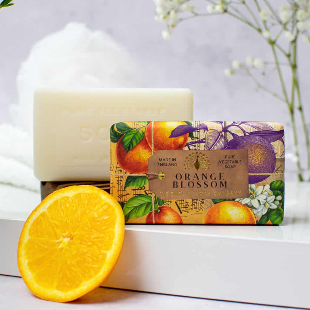 Orange Blossom bar soap by The English Soap Company.  Features an illustrated wrapper with oranges and musical notes.