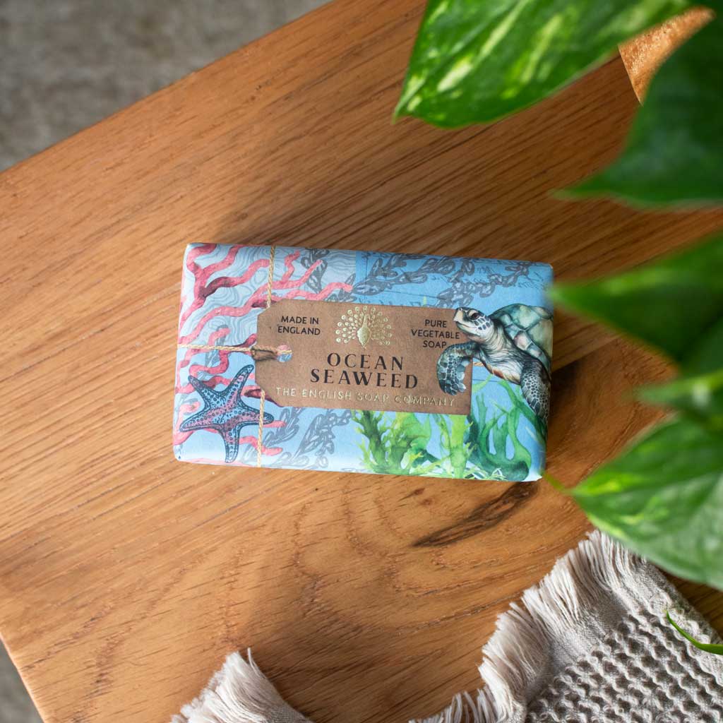 Ocean Seaweed soap bar by The English Soap Company.  Wrapped in blue paper featuring a sea turtle, starfish, and seaweed.