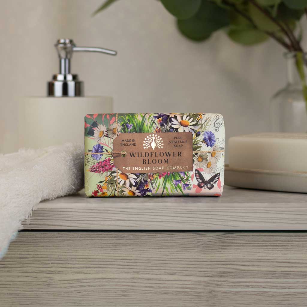 Wildflower bloom soap by the english soap company sitting on the edge of a sink. 