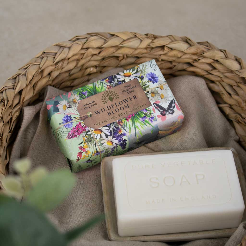 Soap with flower and butterfly packaging - titled Wildflower Bloom, Laying in a wicker basket. 