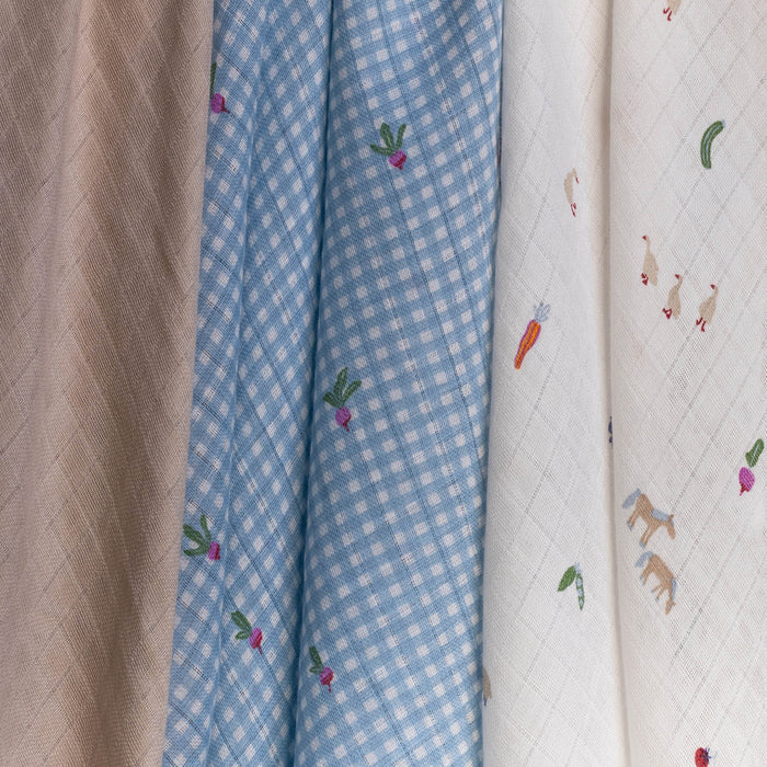 Three different fabrics with patterns displayed side by side.