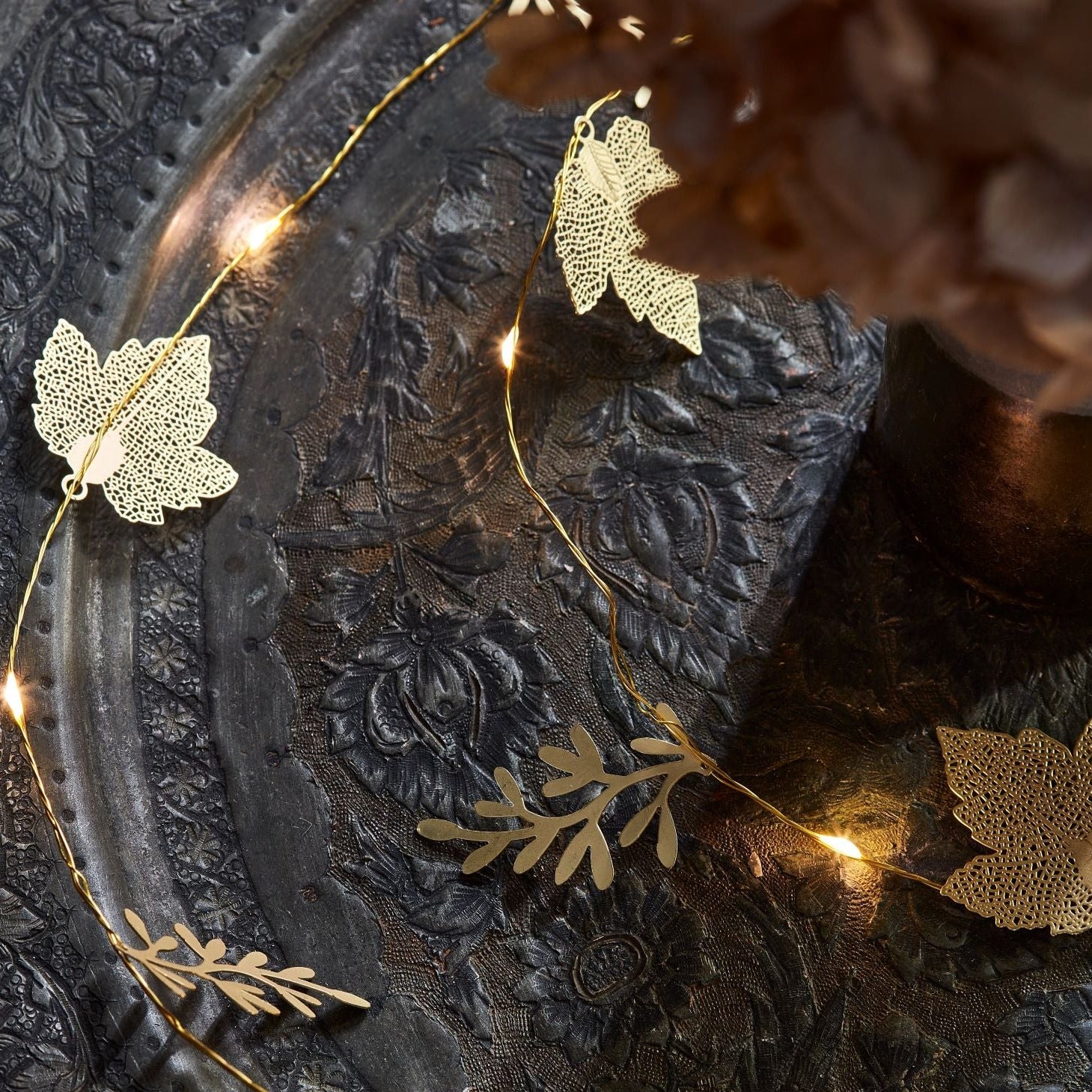 Gold leaf-shaped string lights with warm white LEDs.