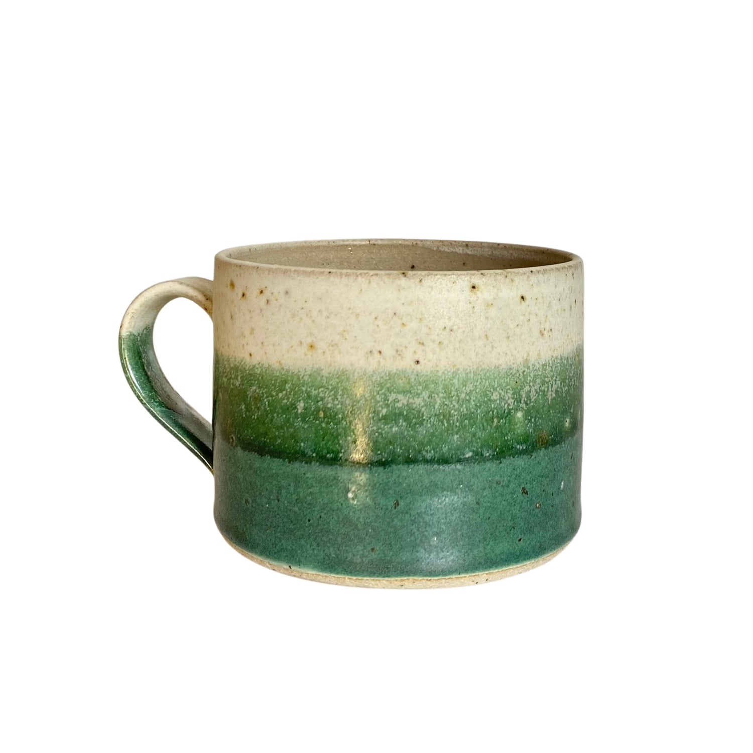 Stoneware mug with a speckled off-white top, transitioning to a light and then a darker green band.