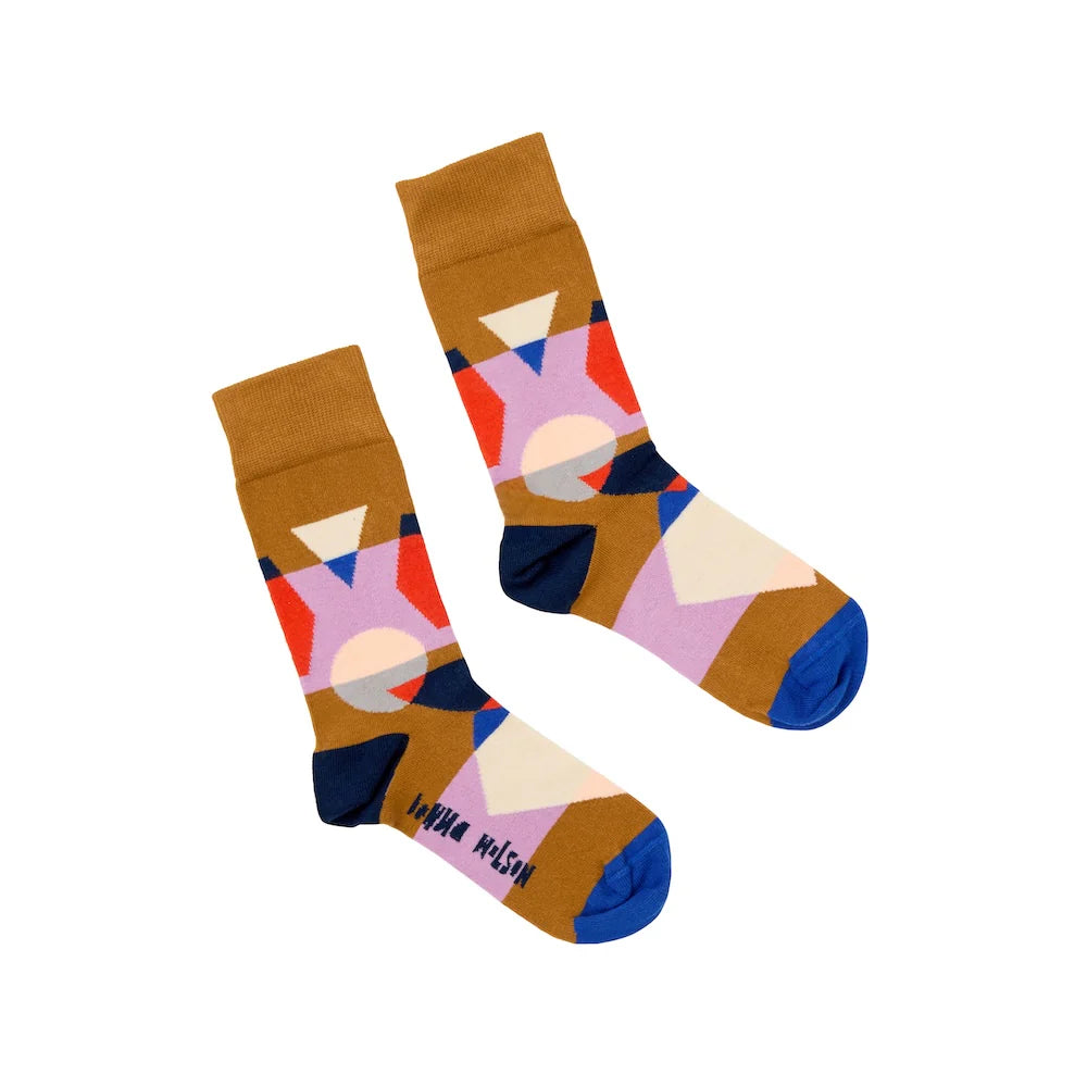 Colorful geometric-patterned socks on a white background