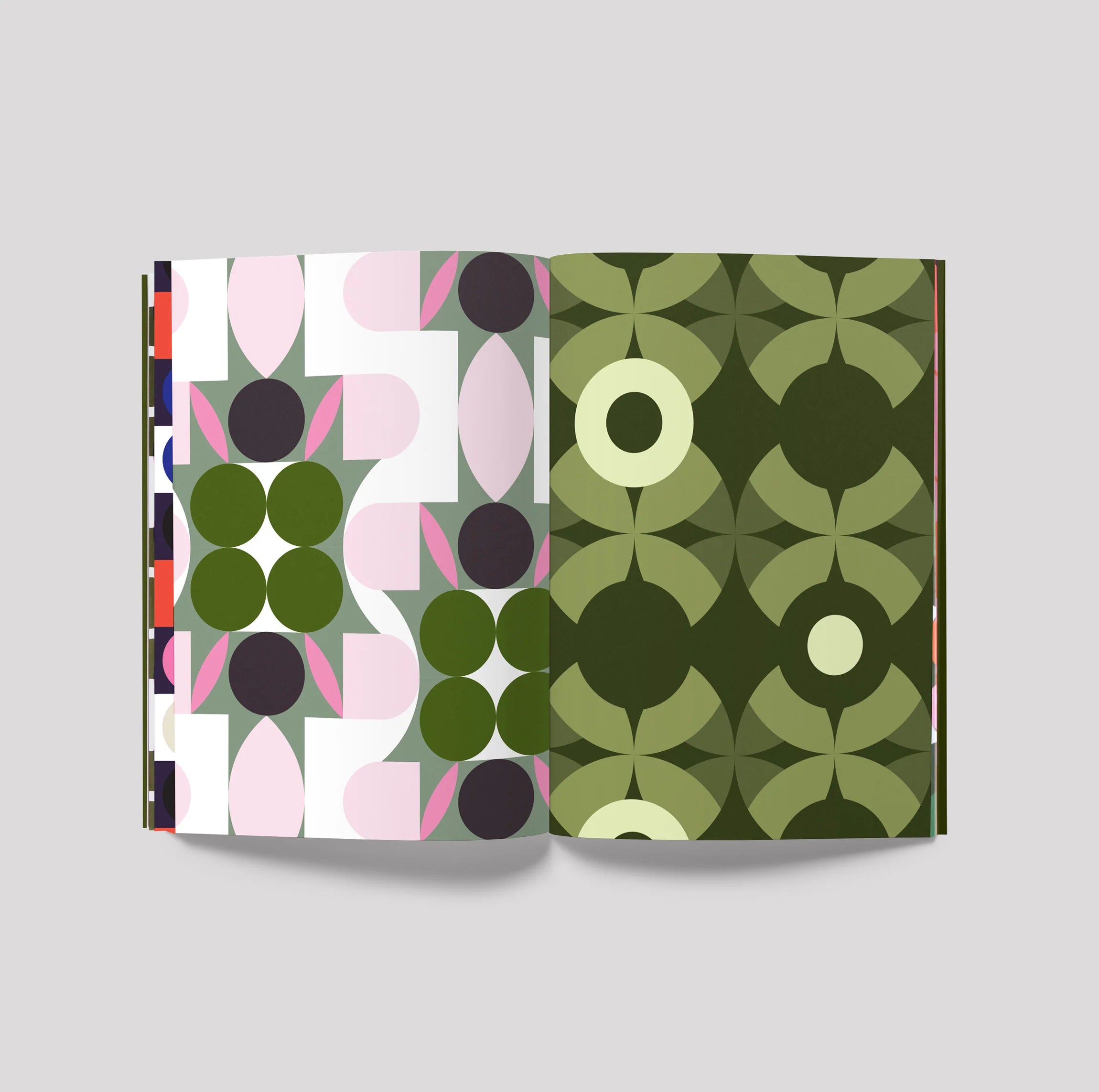 Open book with geometric pattern on a gray background