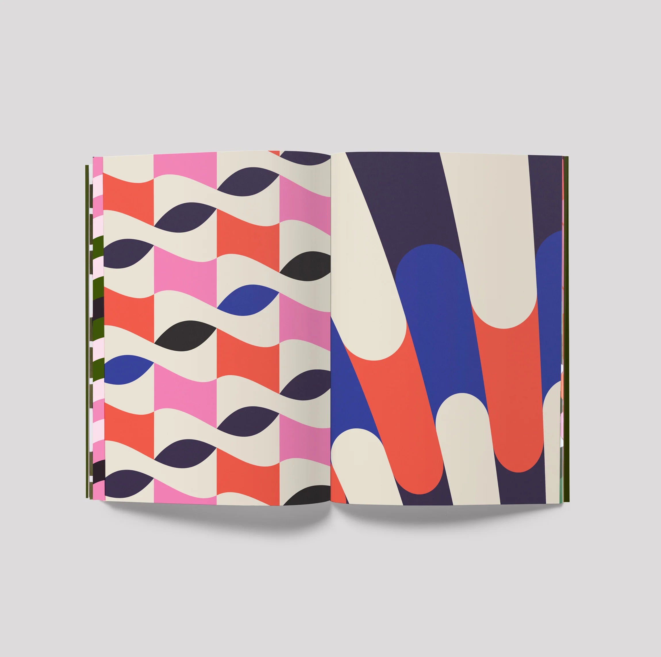 Open book with colorful geometric patterns on a gray background