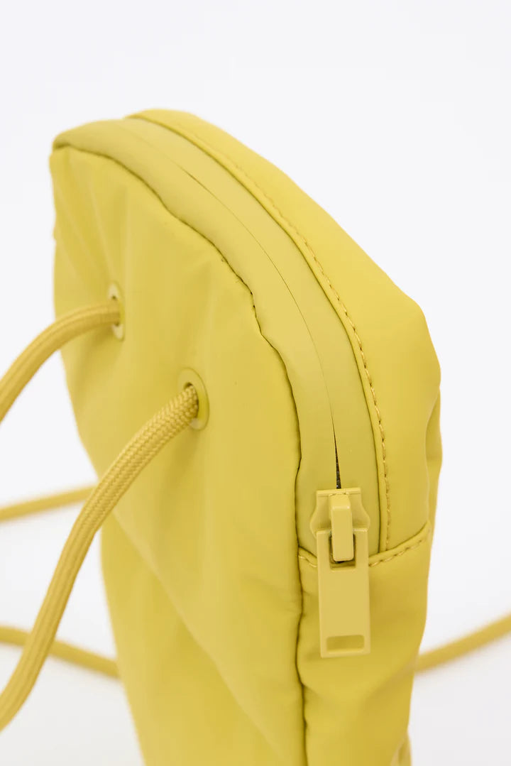 Yellow backpack with a strap on a white background