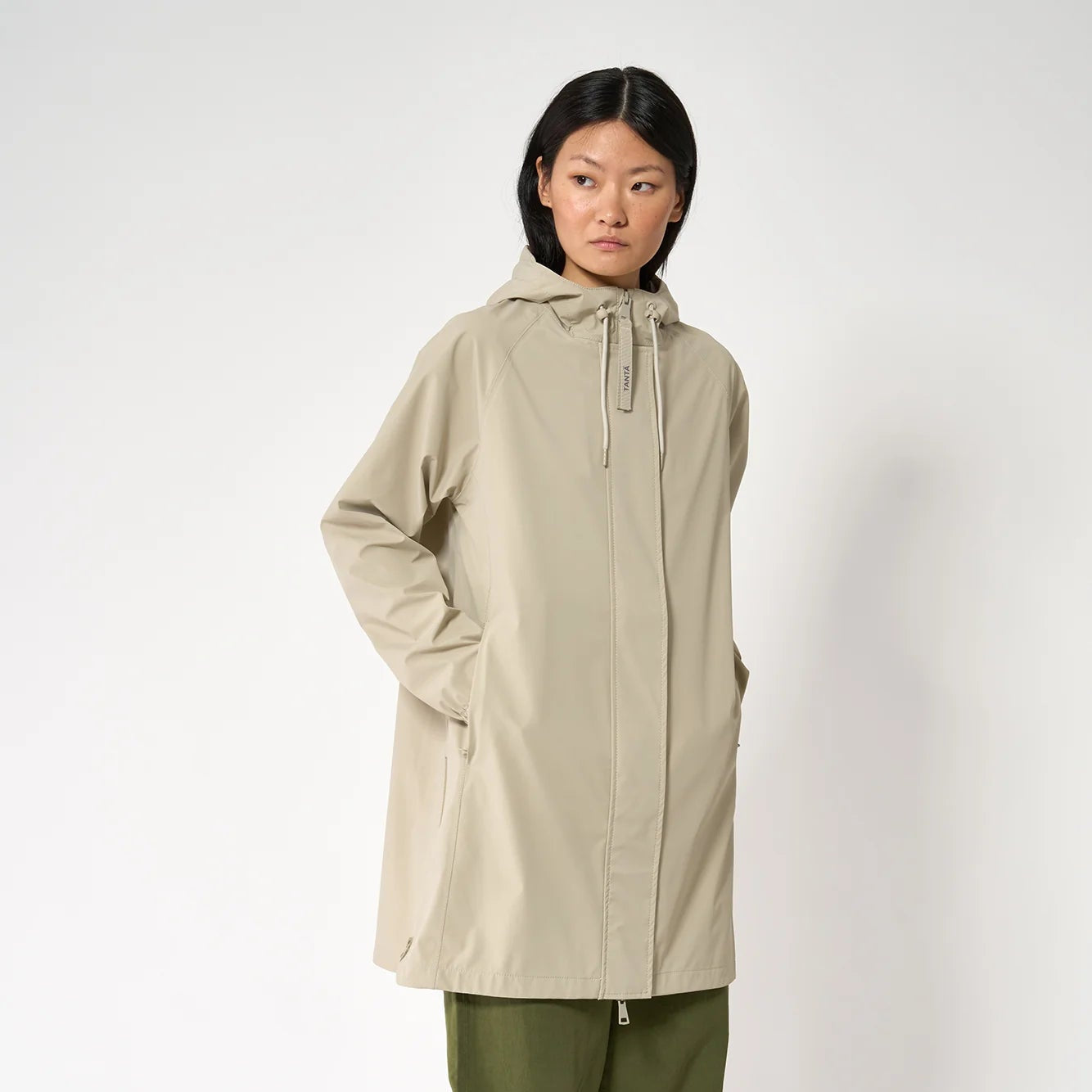 women wearing a stone great summer raincoat 