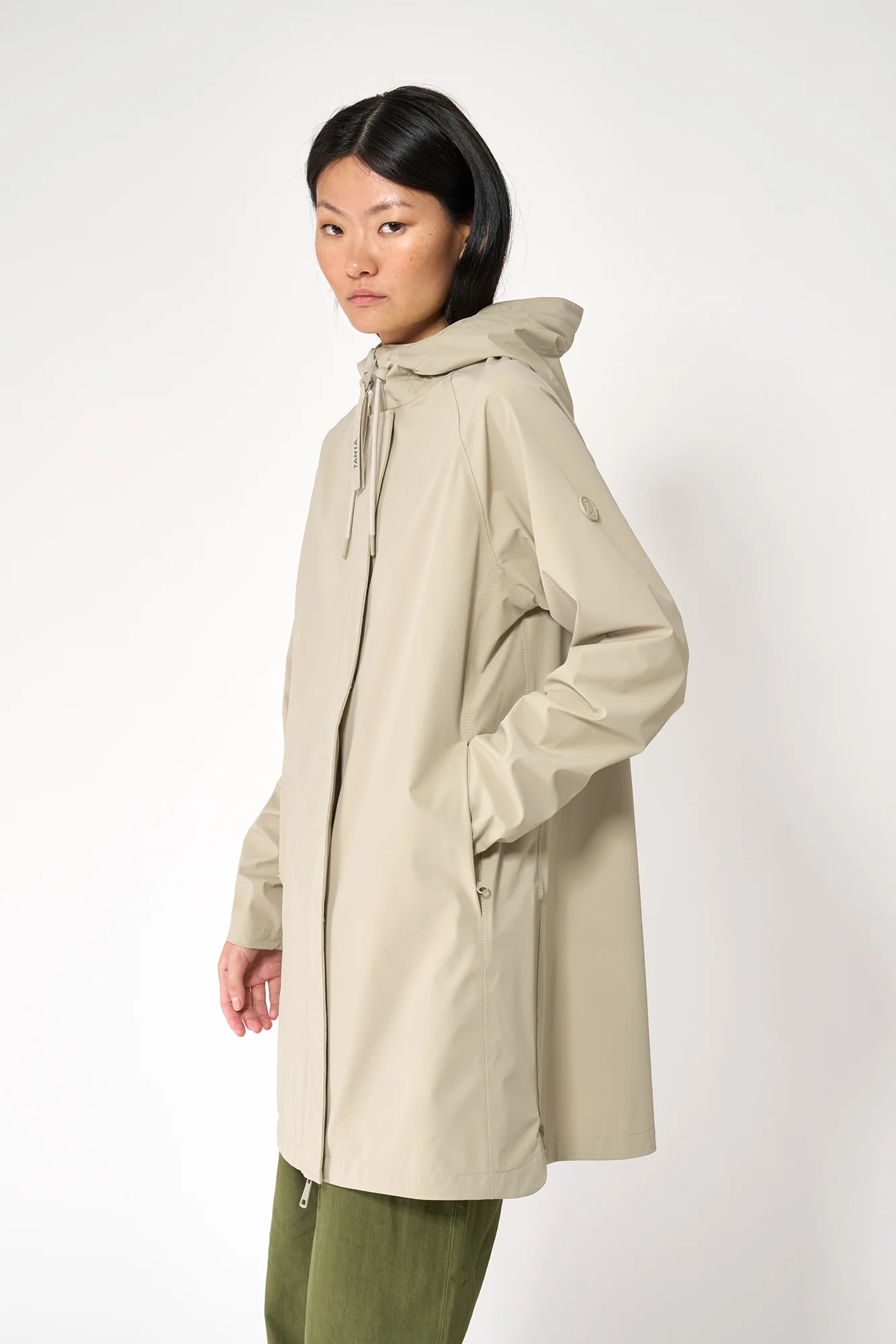 women wearing a stone great summer raincoat 