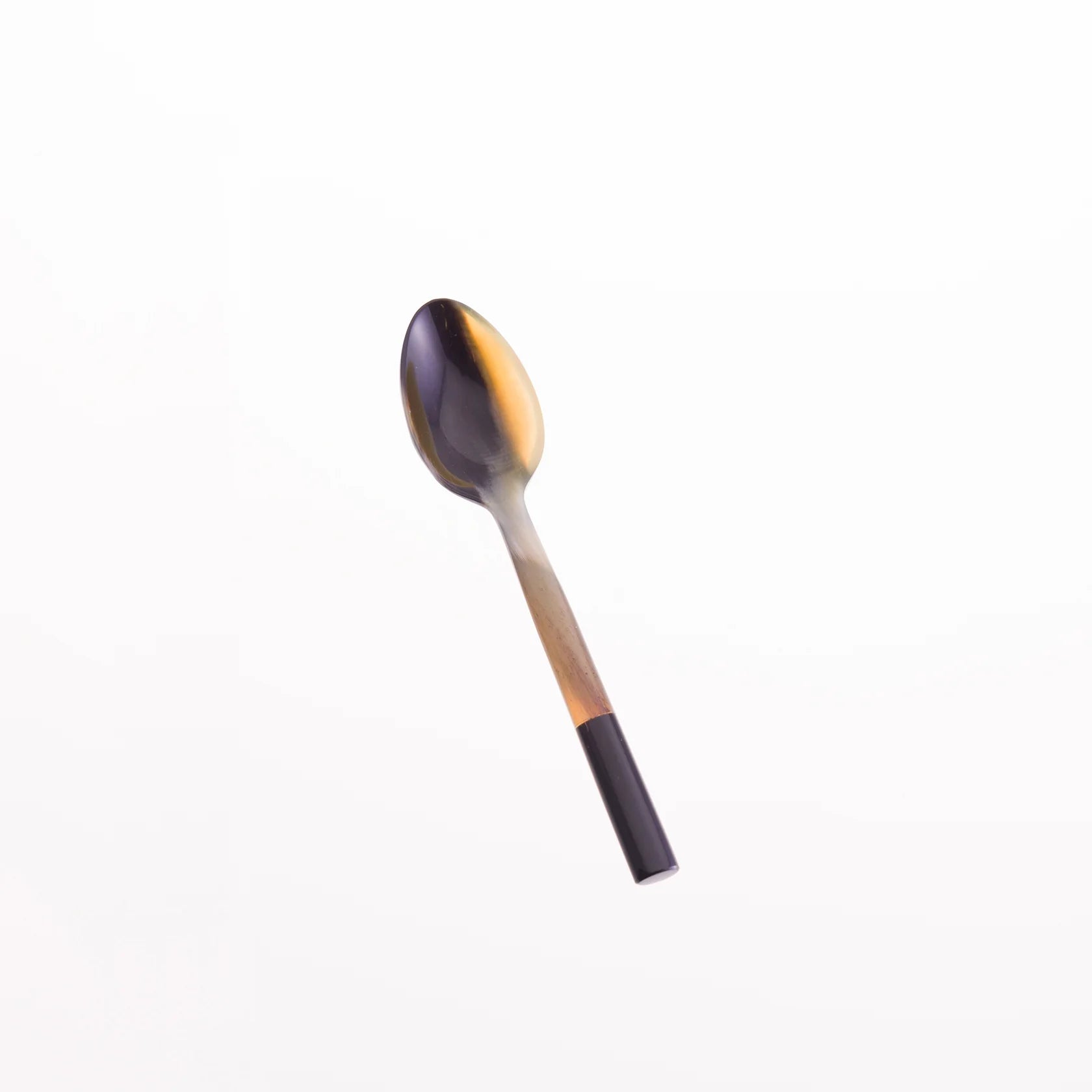Horn spoon with a dark brown and amber bowl and a black handle.