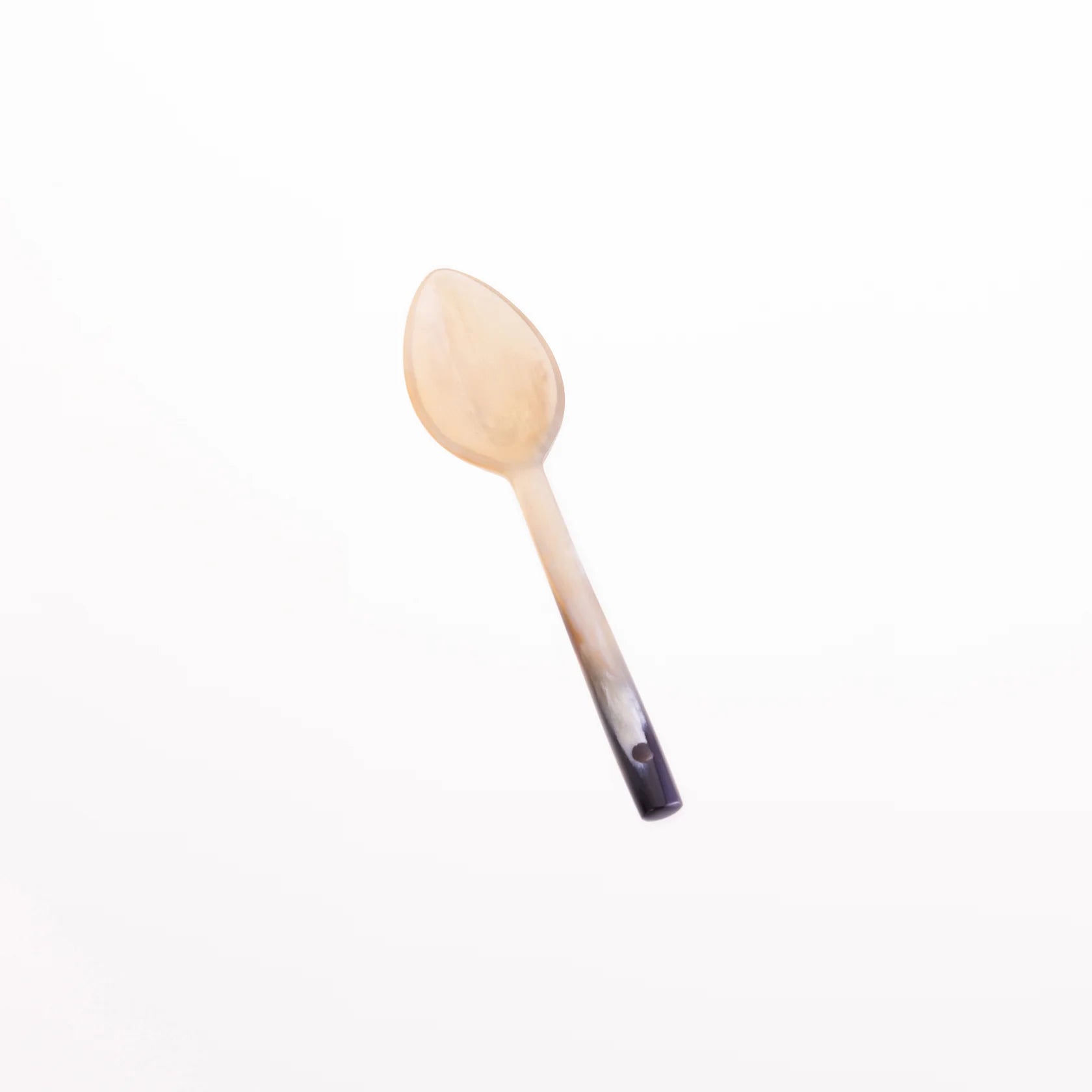 A light beige horn spoon with a dark-tipped handle.