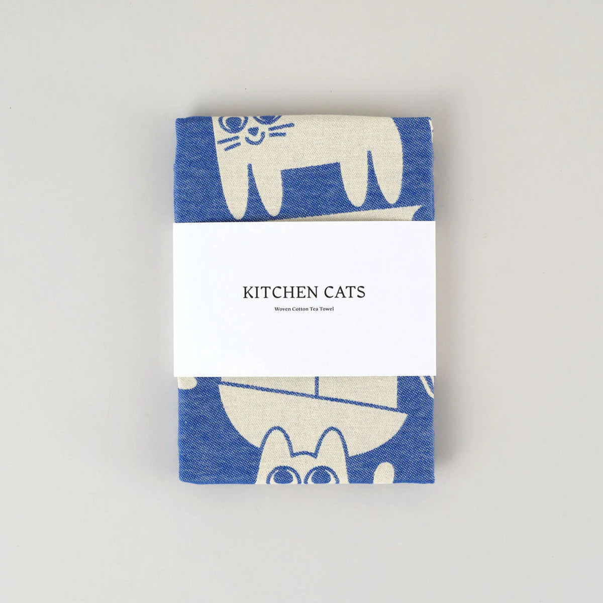 Towel with cat design and 'Kitchen Cats' text on a white background