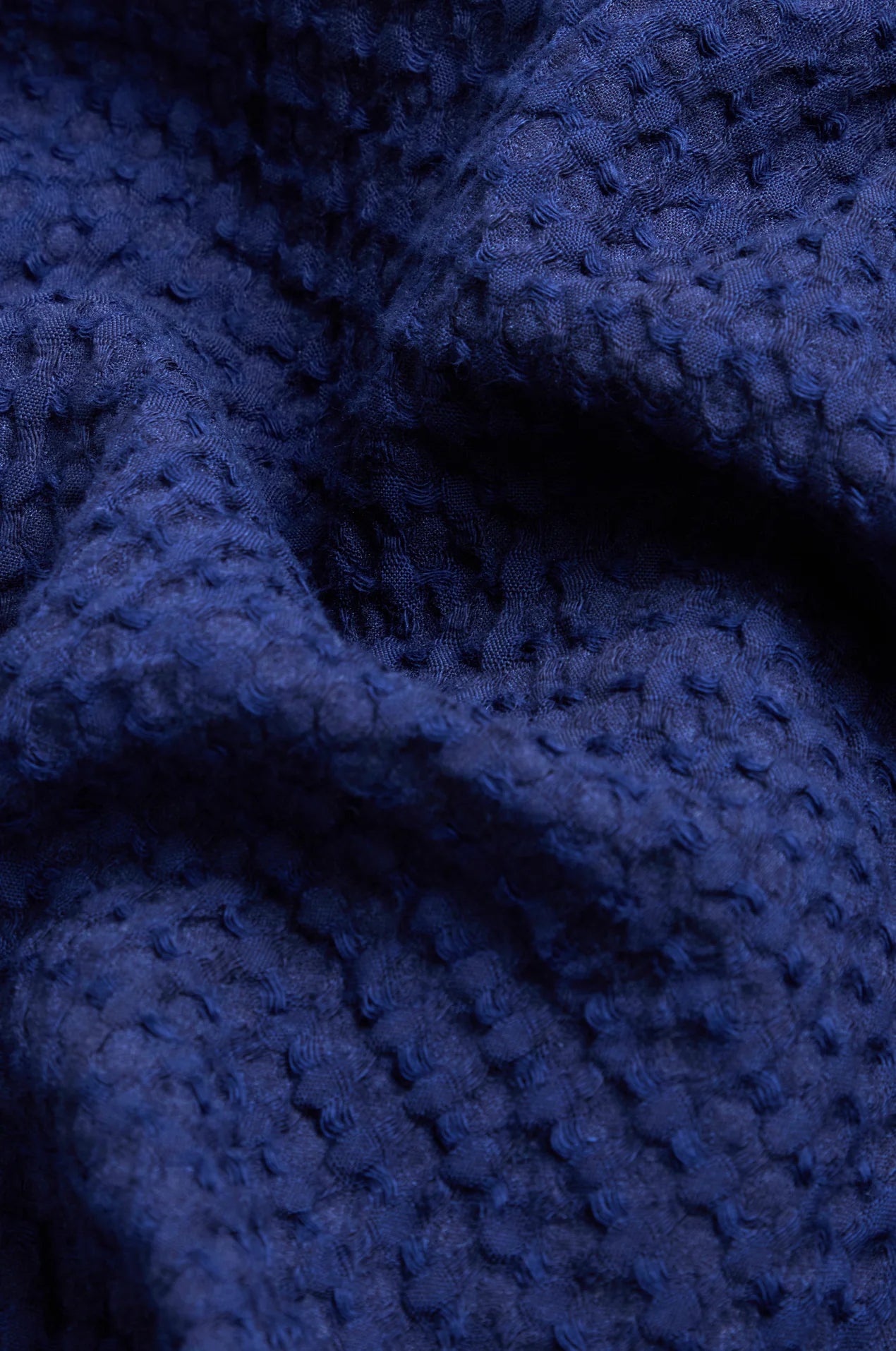 Close-up of textured blue fabric