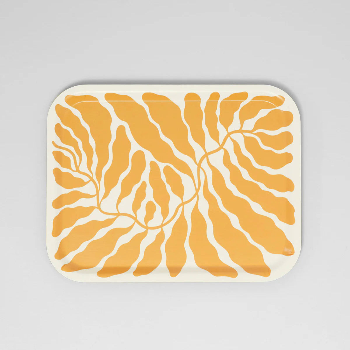 Rectangular placemat with a yellow and white abstract pattern on a gray background
