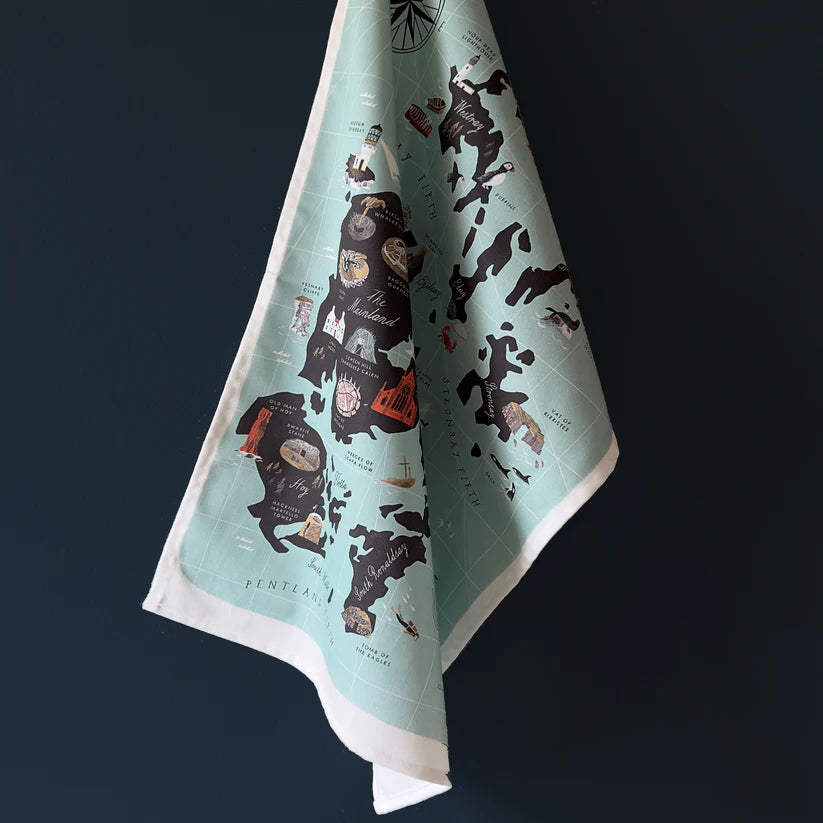 Tea towel featuring an illustrated map of Orkney, Scotland, with teal background and black landmasses, showing various