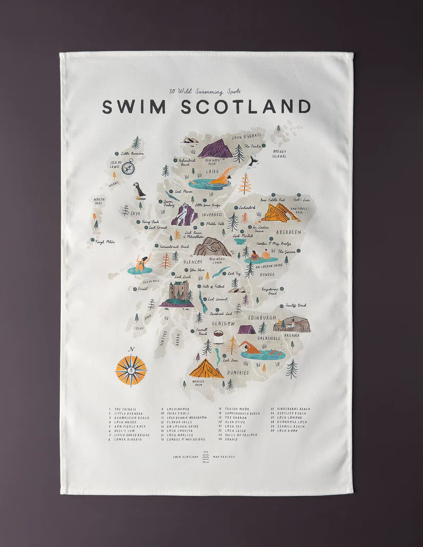 Tea towel featuring an illustrated map of Scotland highlighting 30 wild swimming spots.