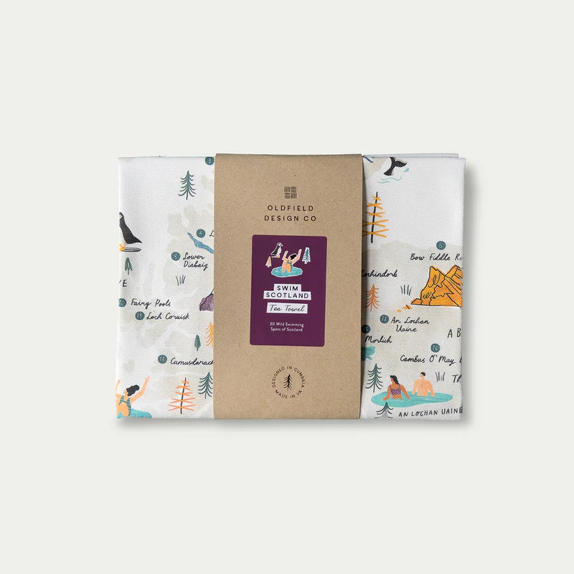 Folded tea towel featuring an illustrated map of 20 Scottish wild swimming spots.