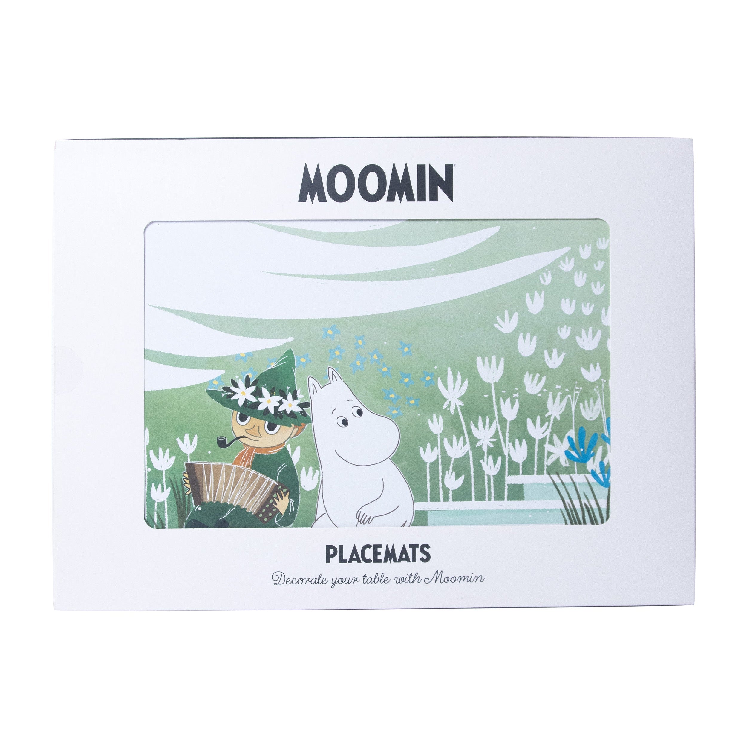 Moomin placemats in a box.  The design features Moomin and a character playing an accordion in a green field with flowers.