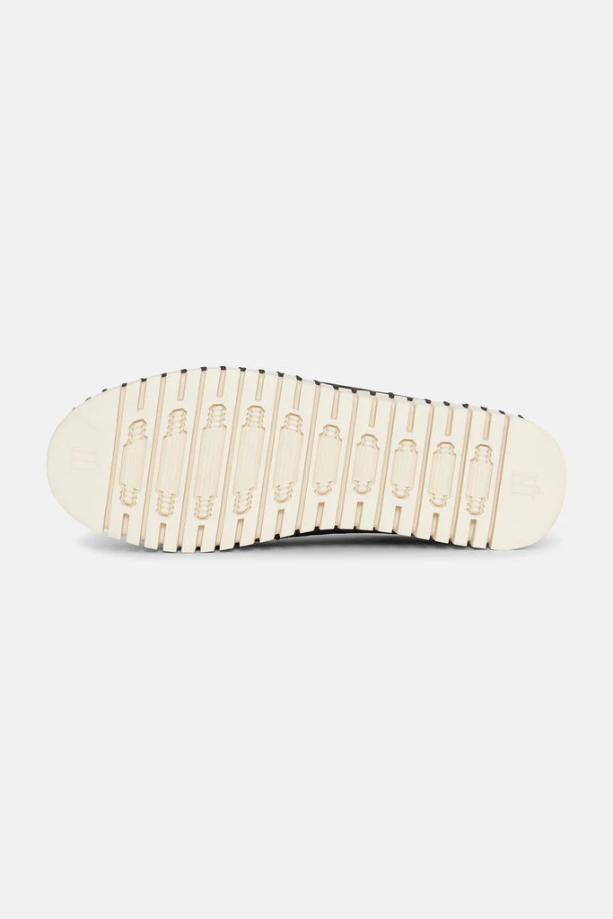 Cream-colored shoe sole with dark-grey top and textured tread pattern.
