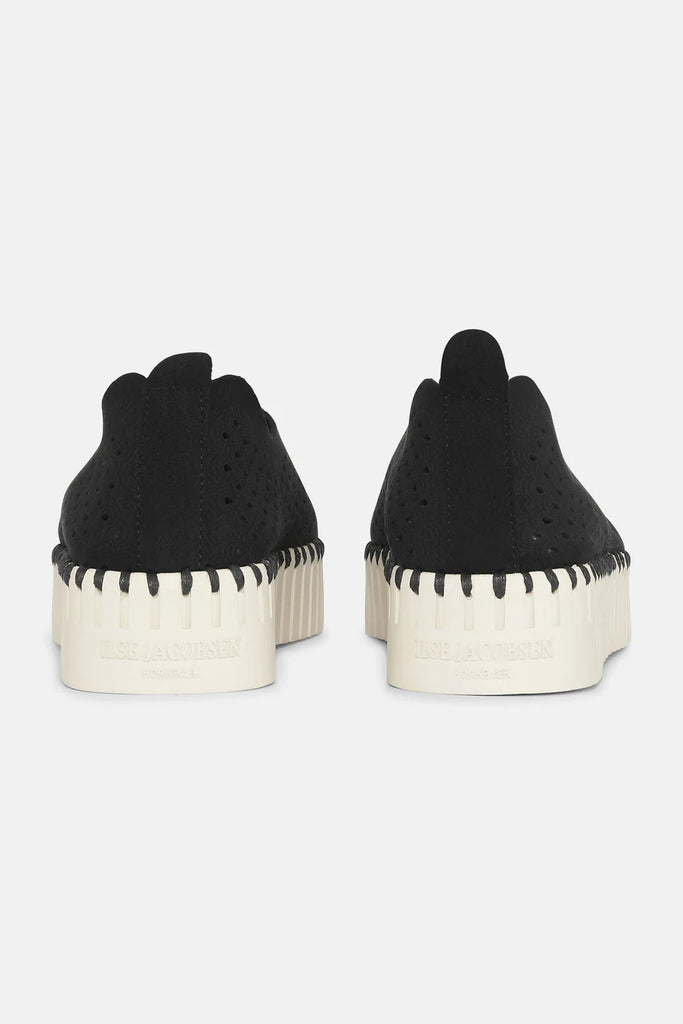 Ilse Jacobsen Hornbæk black perforated slip-on sneakers with off-white platform soles and black stitching detail.