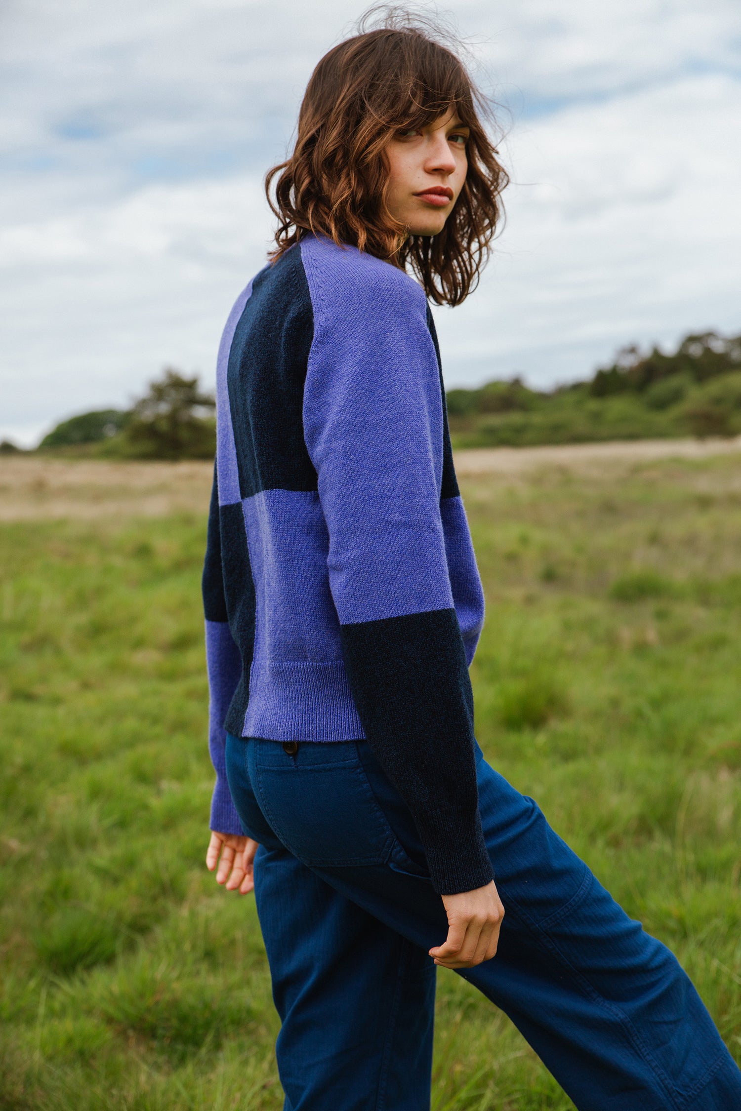 Purple and navy blue color-blocked wool sweater with a relaxed fit.