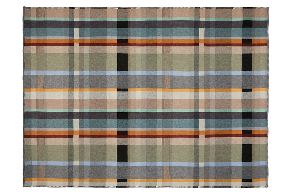 Plaid blanket with a pattern of brown, green, and black stripes on a white background