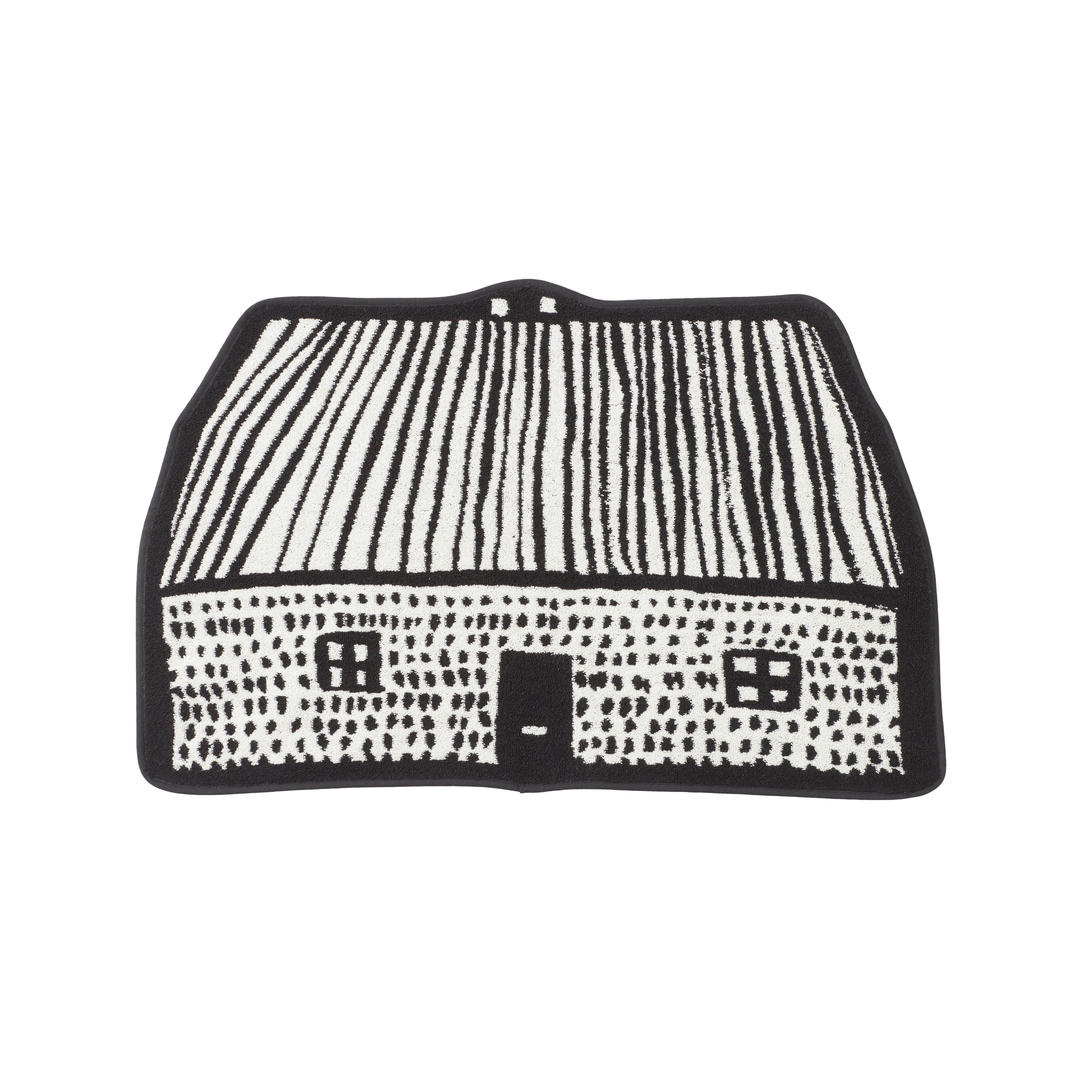 Black and white patterned mat resembling a house, designed by Donna Wilson.