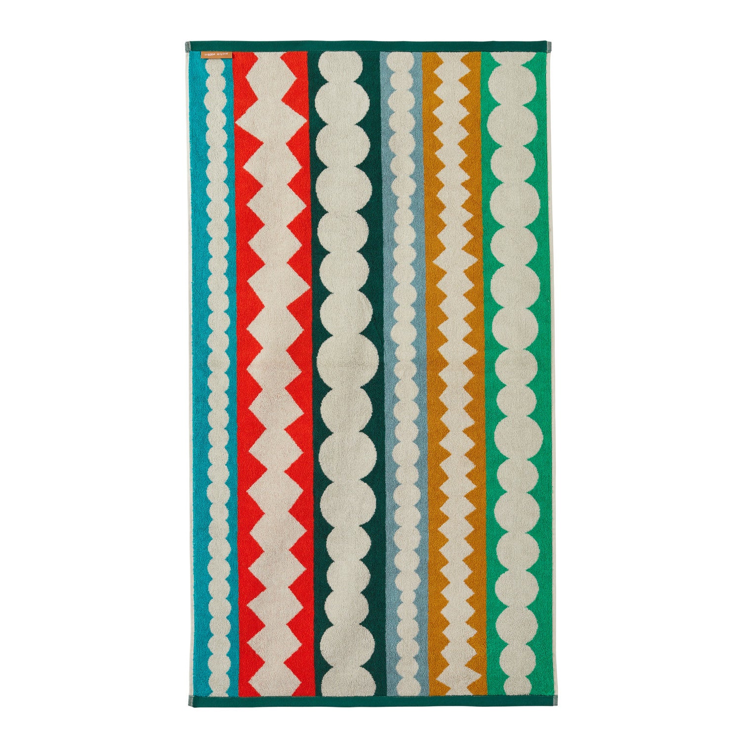 Multi-colored striped rug by Donna Wilson featuring red, green, beige, orange, and blue patterns.