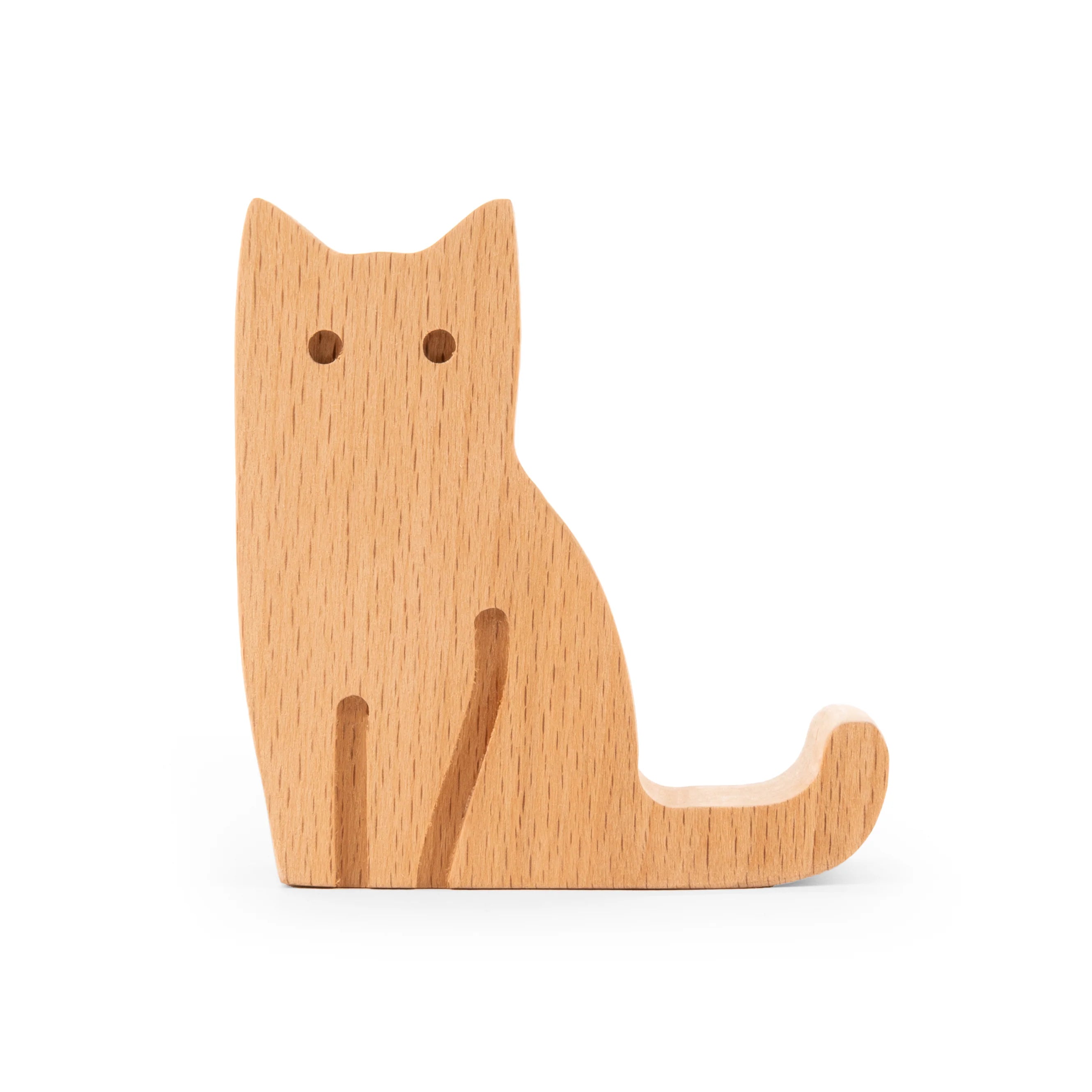 Light brown wooden cat figurine in a sitting position, simply carved with minimal detail.