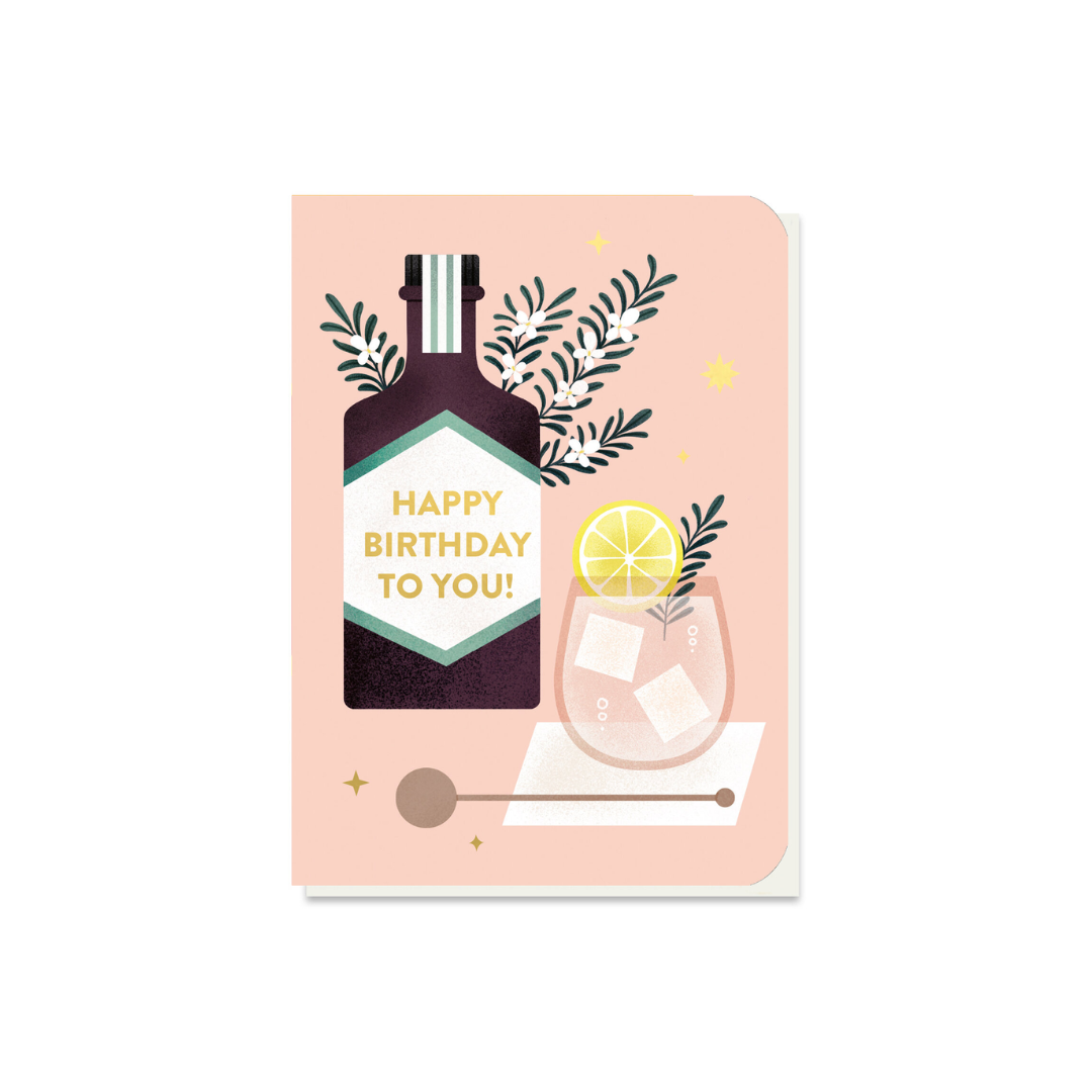 Birthday card featuring a gin bottle and cocktail glass with ice and lemon; "Happy Birthday To You!" on the bottle label.