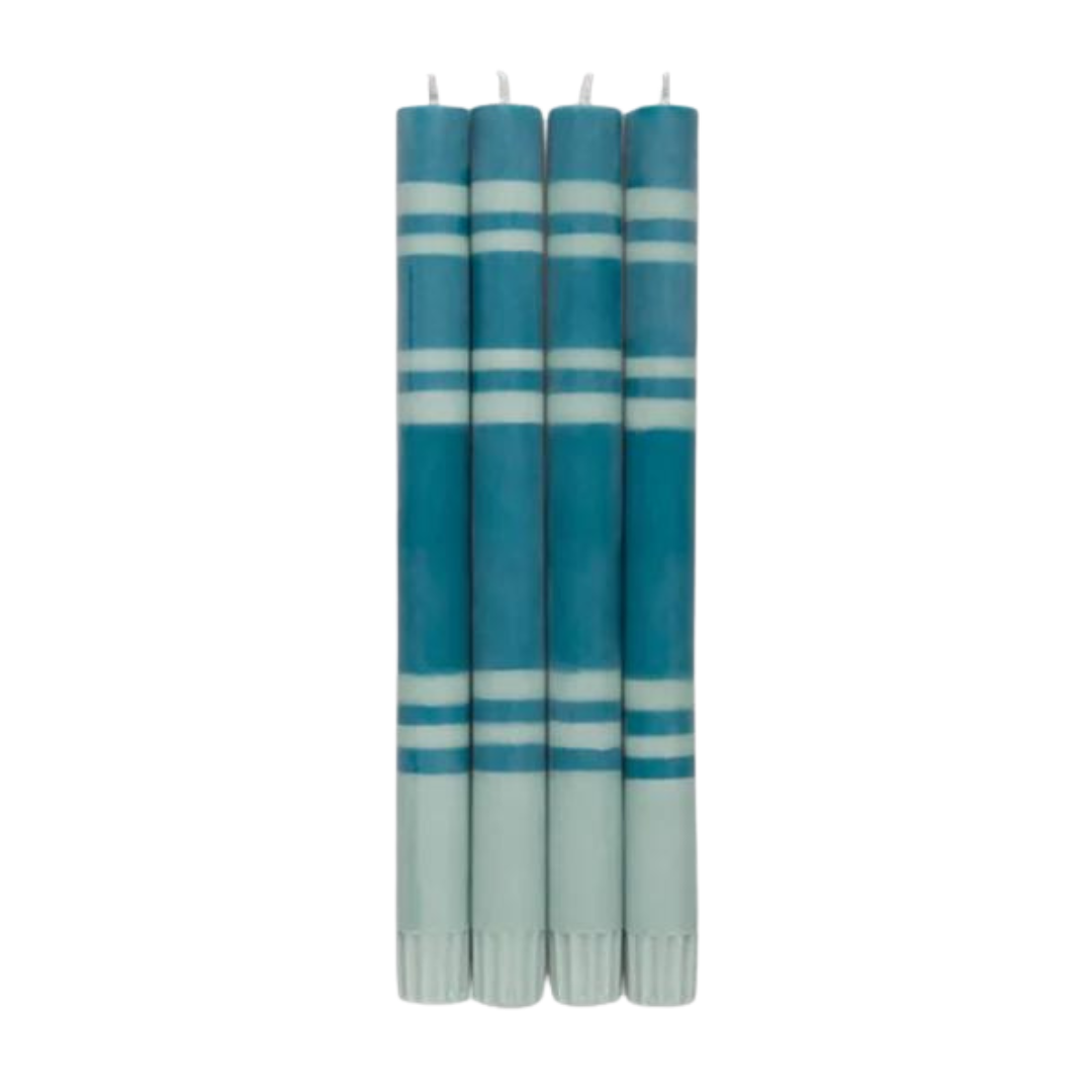 Four teal taper candles with white stripes and light teal bases.
