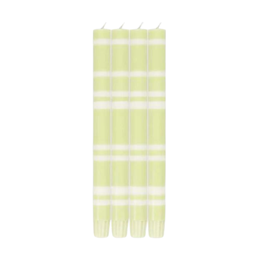 Four pale green taper candles with white horizontal stripes.