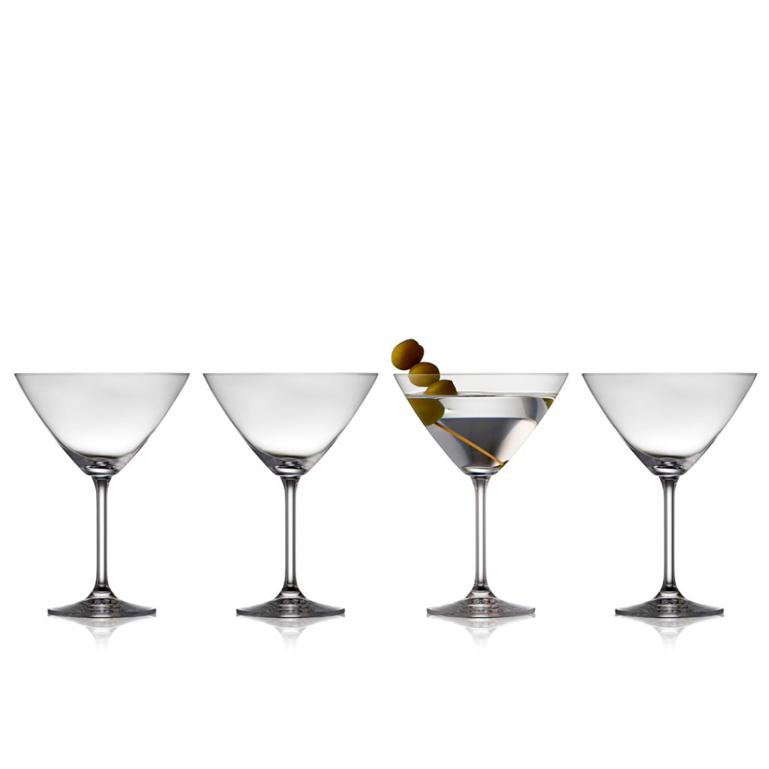 Martini glass with olives and two empty martini glasses.