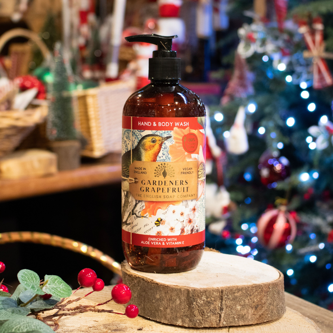 Amber bottle of Gardener's Grapefruit hand and body wash by The English Soap Company.  Features a robin and floral design.