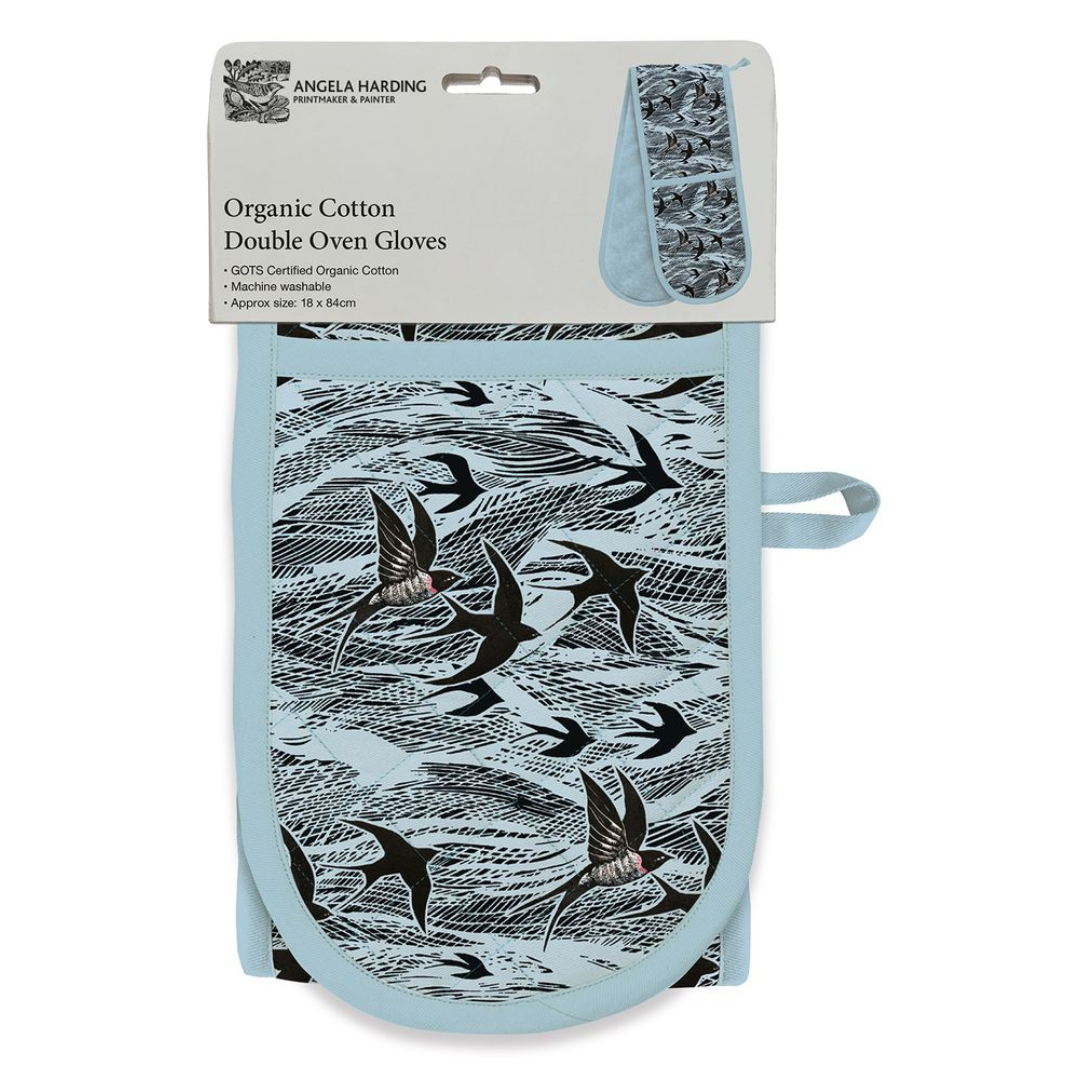 Double oven gloves in light blue, featuring a black swallow print on a wave pattern.