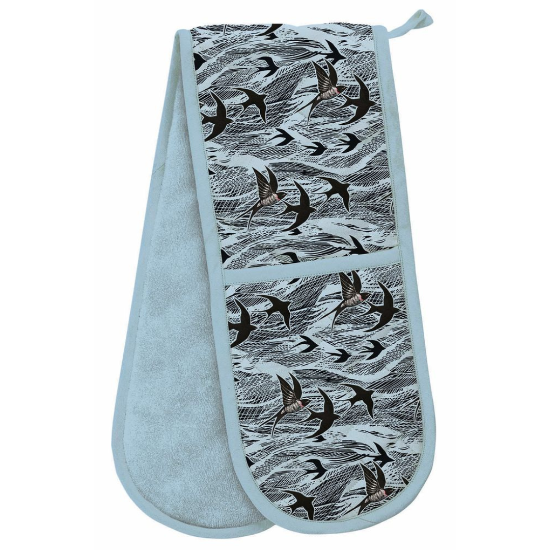 Double oven mitt with light blue terry cloth backing and a black and white swallow print on the front.