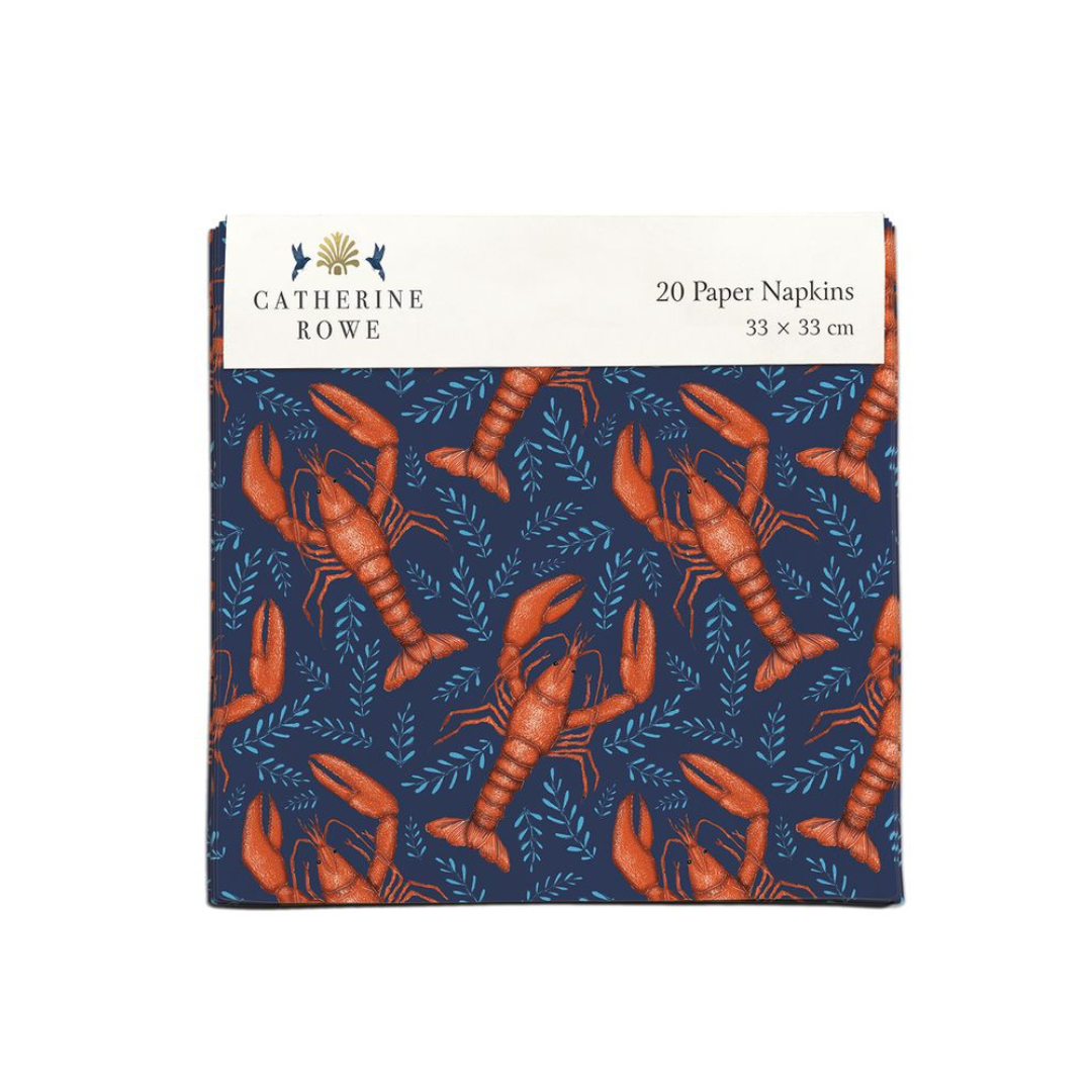 Twenty navy blue paper napkins featuring a repeating pattern of orange lobsters and teal leaves. 33 x 33 cm.