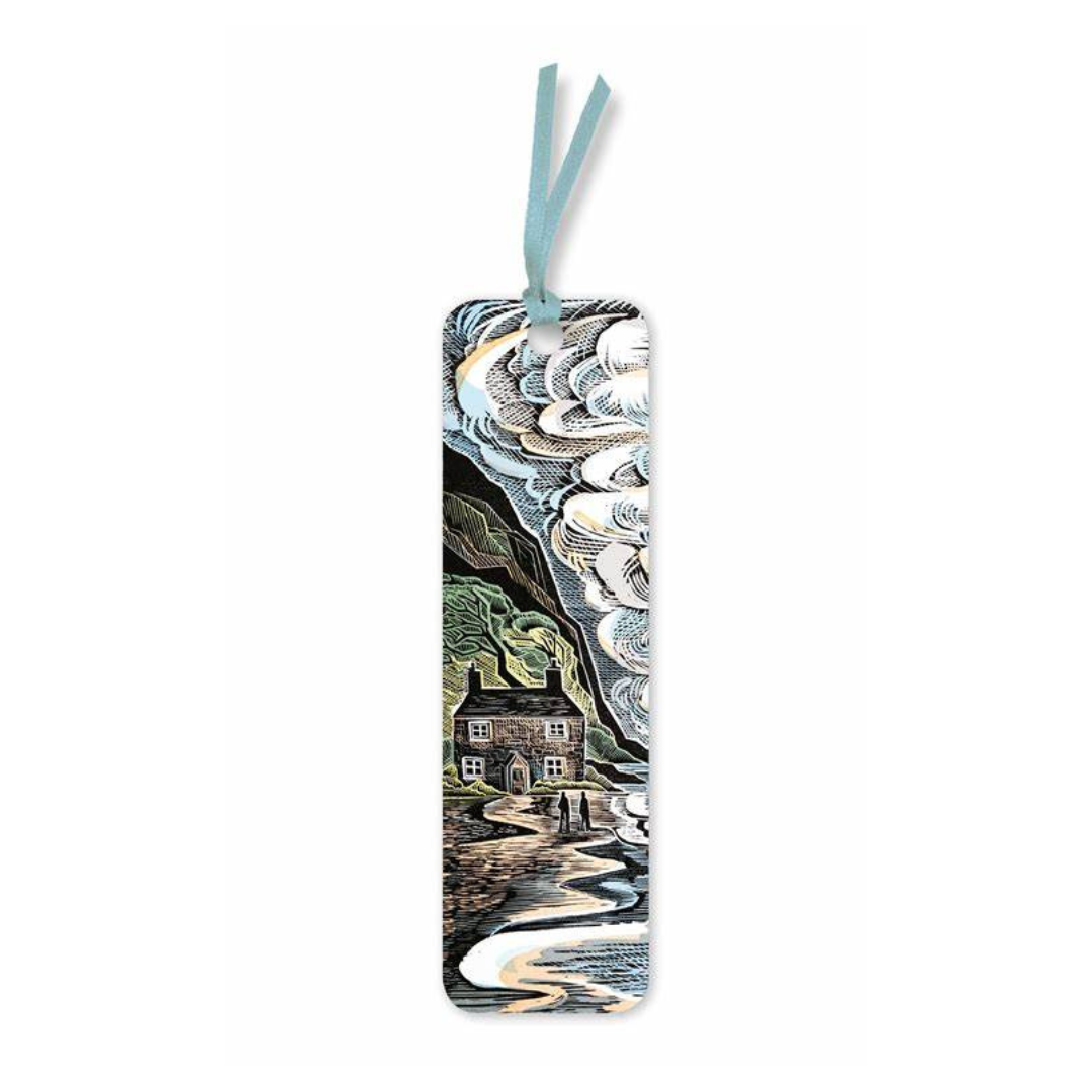 Bookmark featuring a linocut-style illustration of a cottage on a coast under dramatic clouds; two figures stand on a path