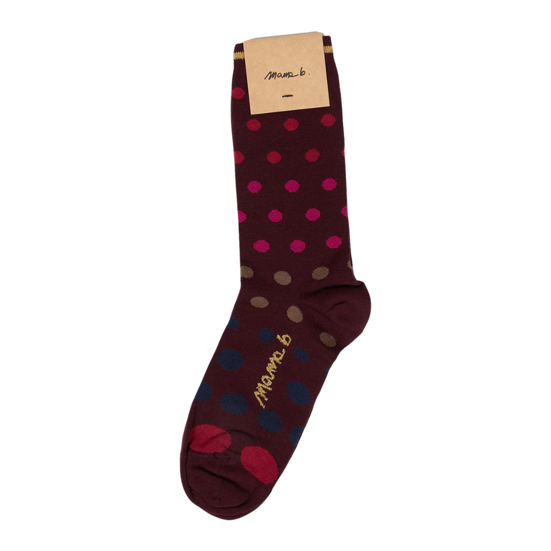 Marimekko sock with maroon base and multicolored polka dots.
