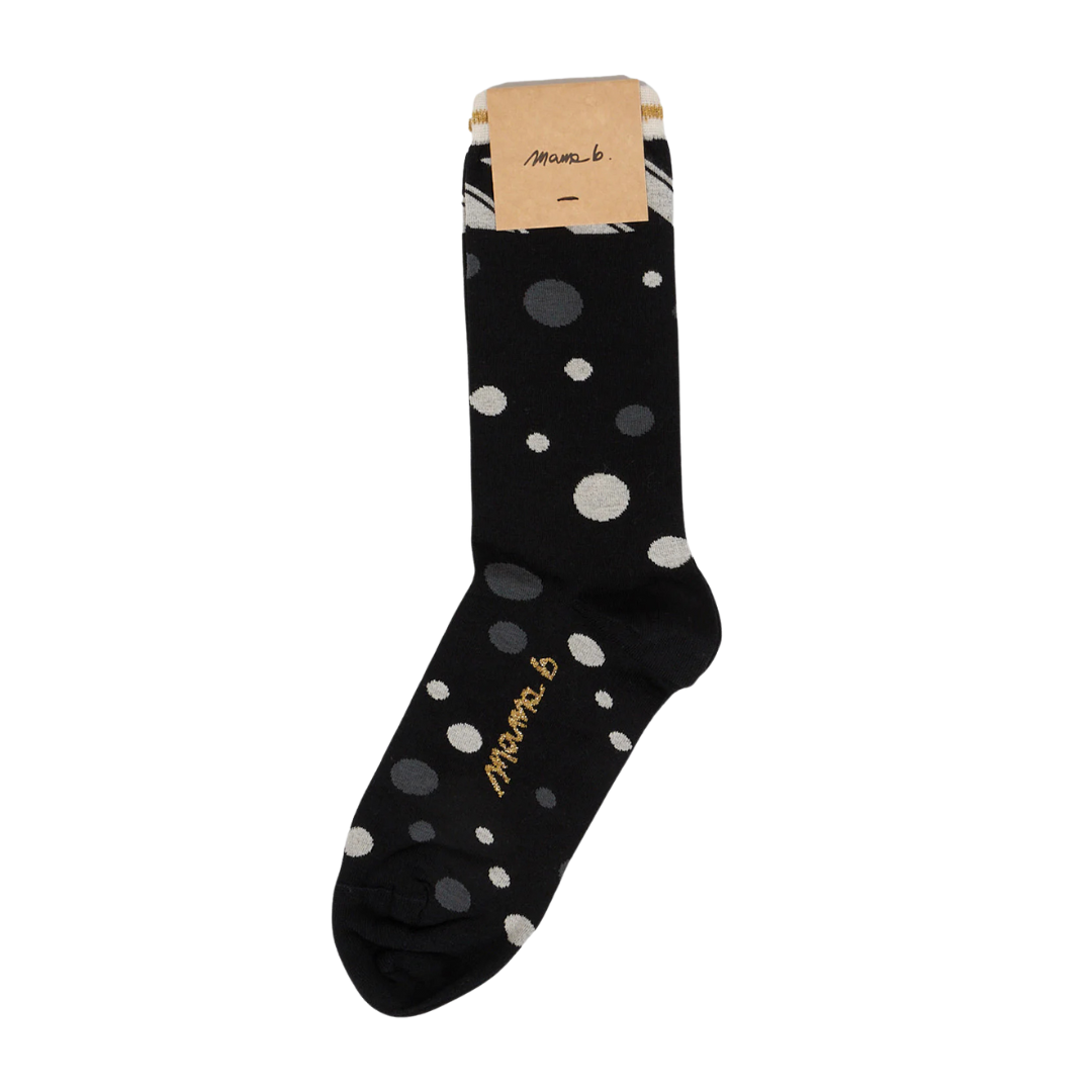 Black sock with off-white and gray polka dots and gold "Mama b." logo.