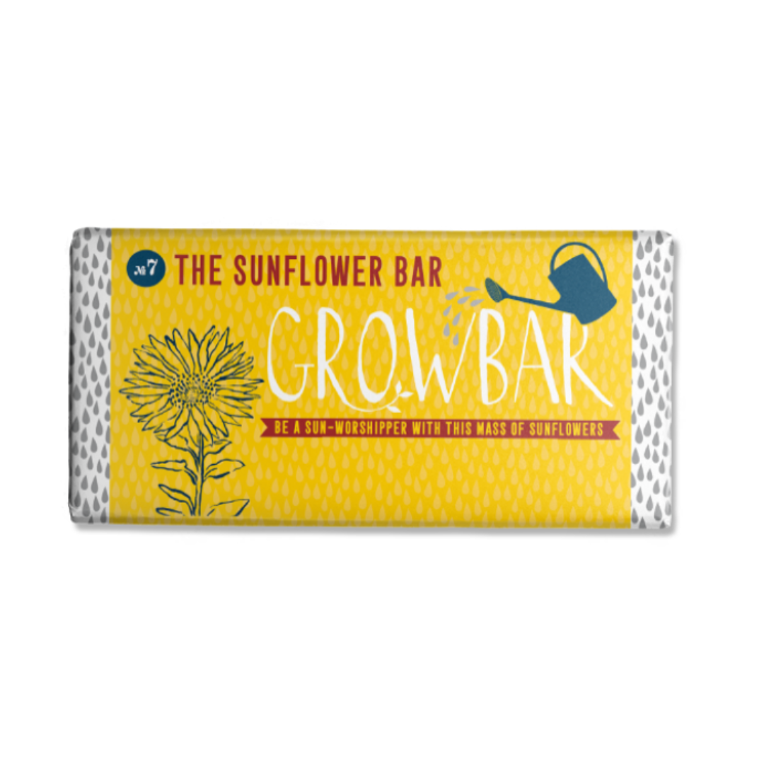 Yellow "Growbar" sunflower seed bar wrapper with illustration of sunflower and watering can.