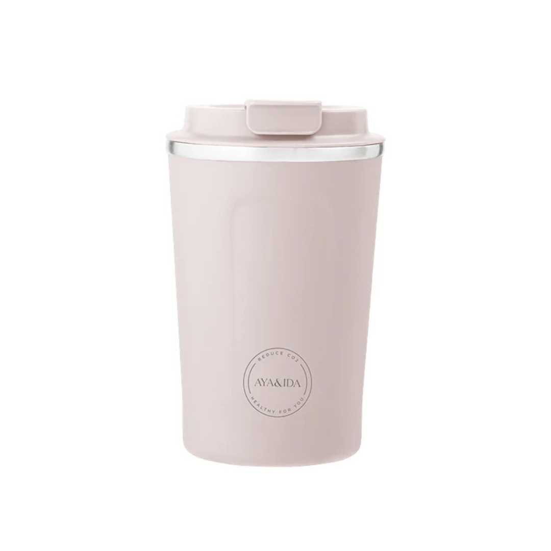 Pale pink reusable coffee cup with lid and silver band.  "AYA&IDA" logo is visible.