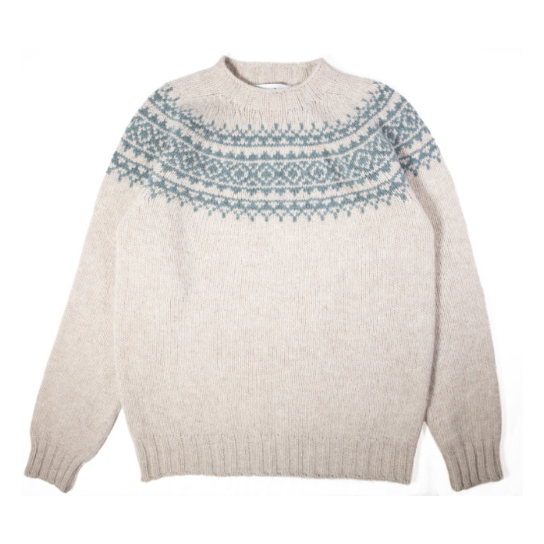 Beige wool crewneck sweater with a teal Fair Isle yoke pattern.