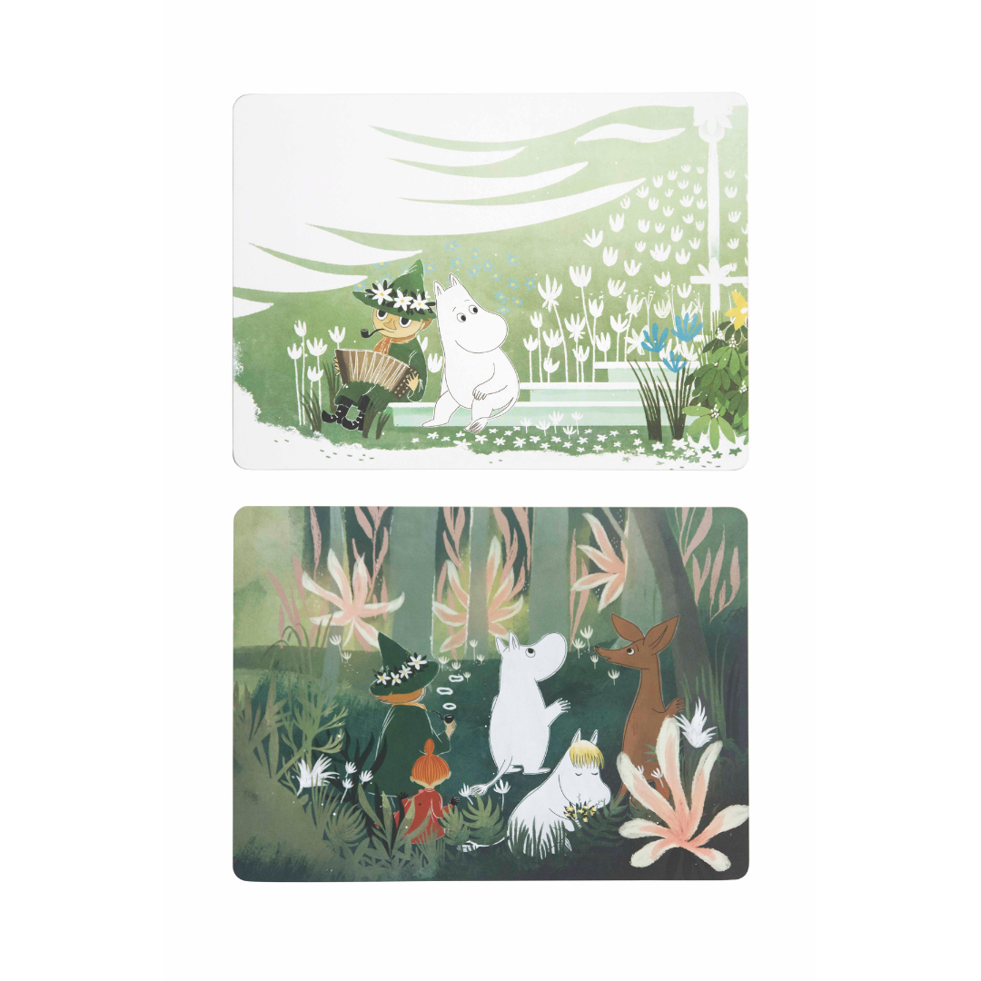 Set of two Moomin-themed placemats.  Top placemat depicts Moomin and a musician in a garden.