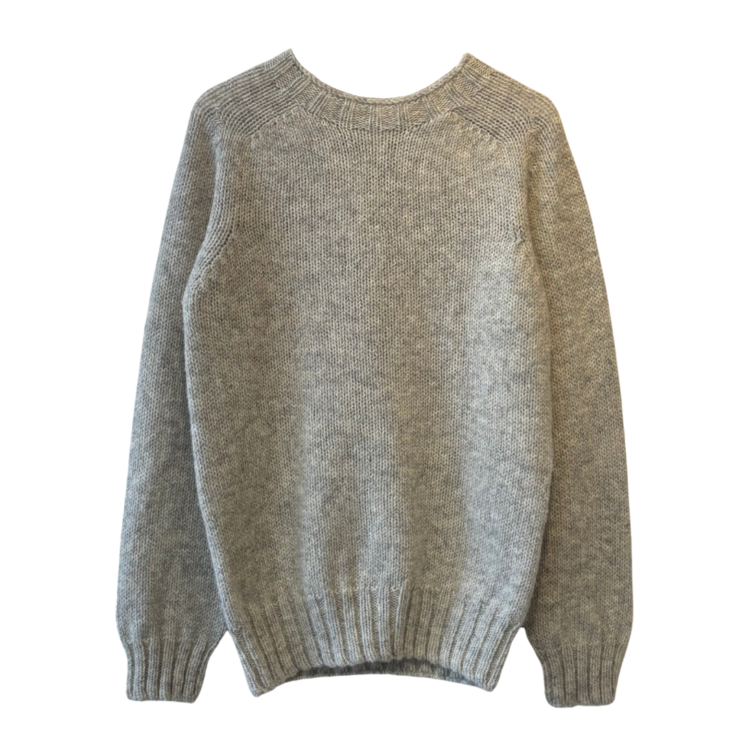 Light gray, long-sleeved, knit wool sweater with a crew neck.